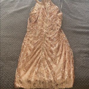 A gold custom dress never been used